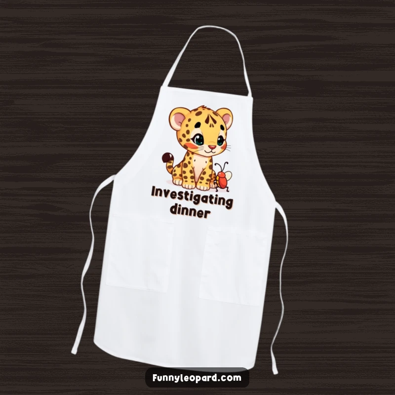Funny apron decorated with a curious leopard cub cub tilting its head at a wiggling bug, bringing humor to the kitchen.