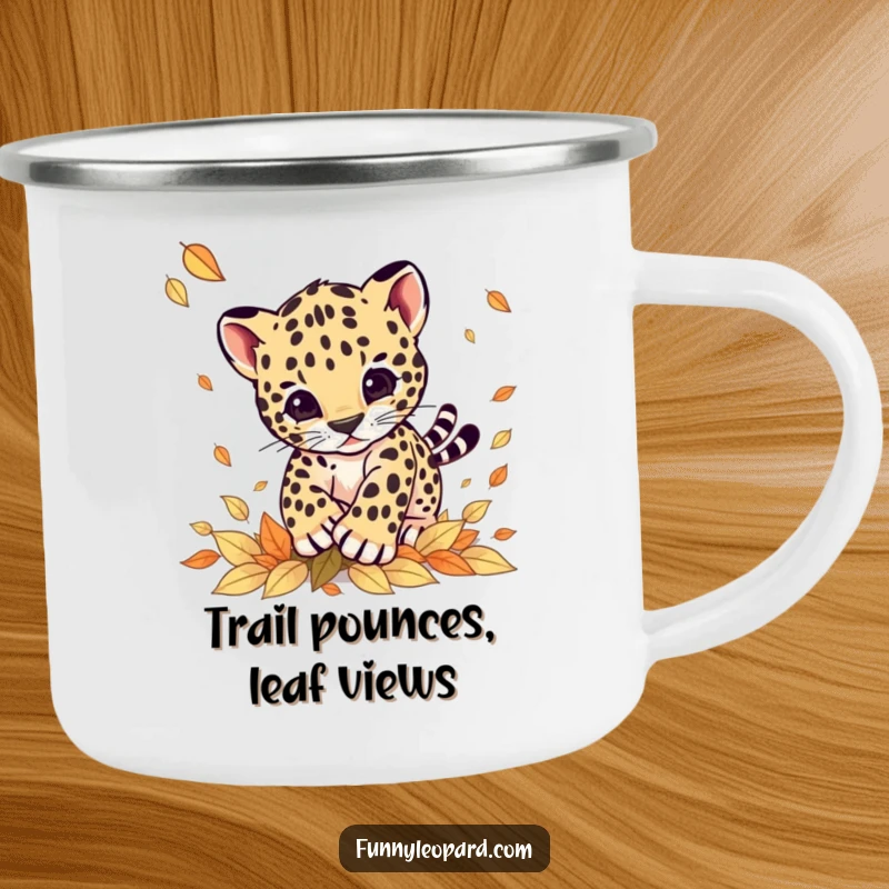 Funny camping mug with a cute leopard cub joyfully pouncing on falling leaves, perfect for outdoor enthusiasts seeking a smile.