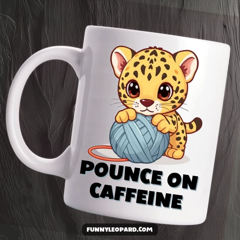 Funny leopard cub mug, a cute kitten playfully pouncing on a yarn ball with big eyes, perfect for animal humor.