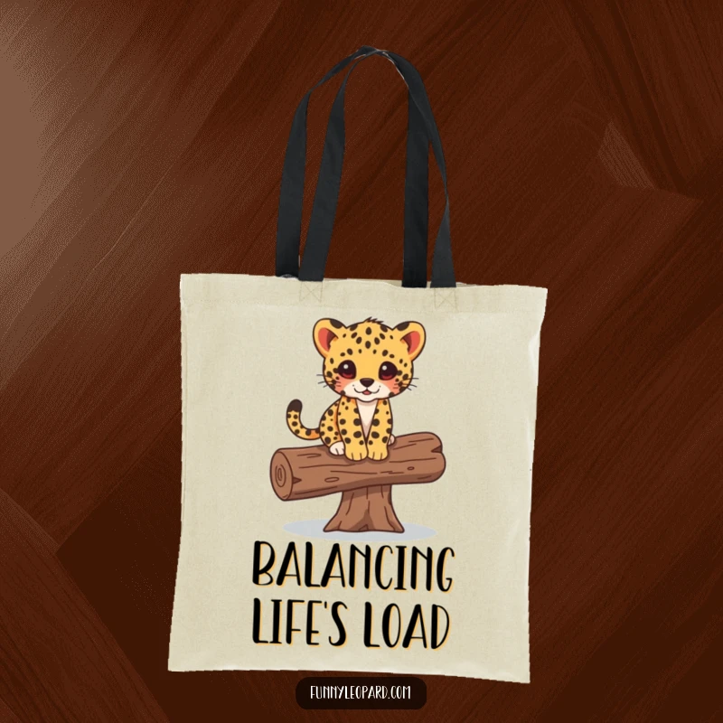 Funny tote bag depicting a small leopard cub carefully balancing on a fallen log, embodying playful adventure and everyday utility.